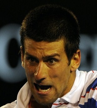 Novak Djokovic of Serbia returns against